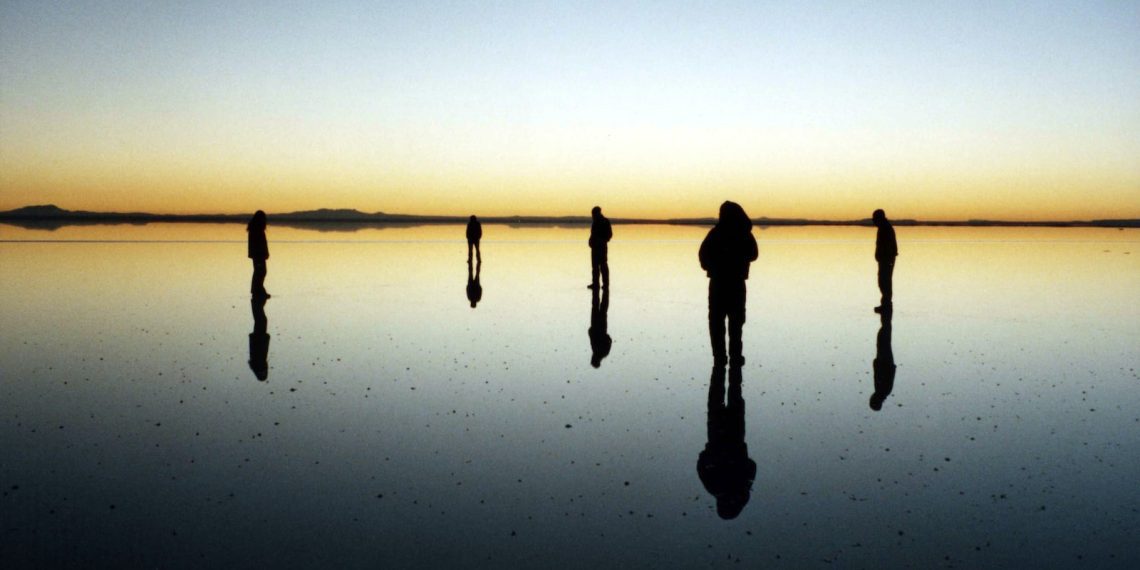 silhouette of five person standing